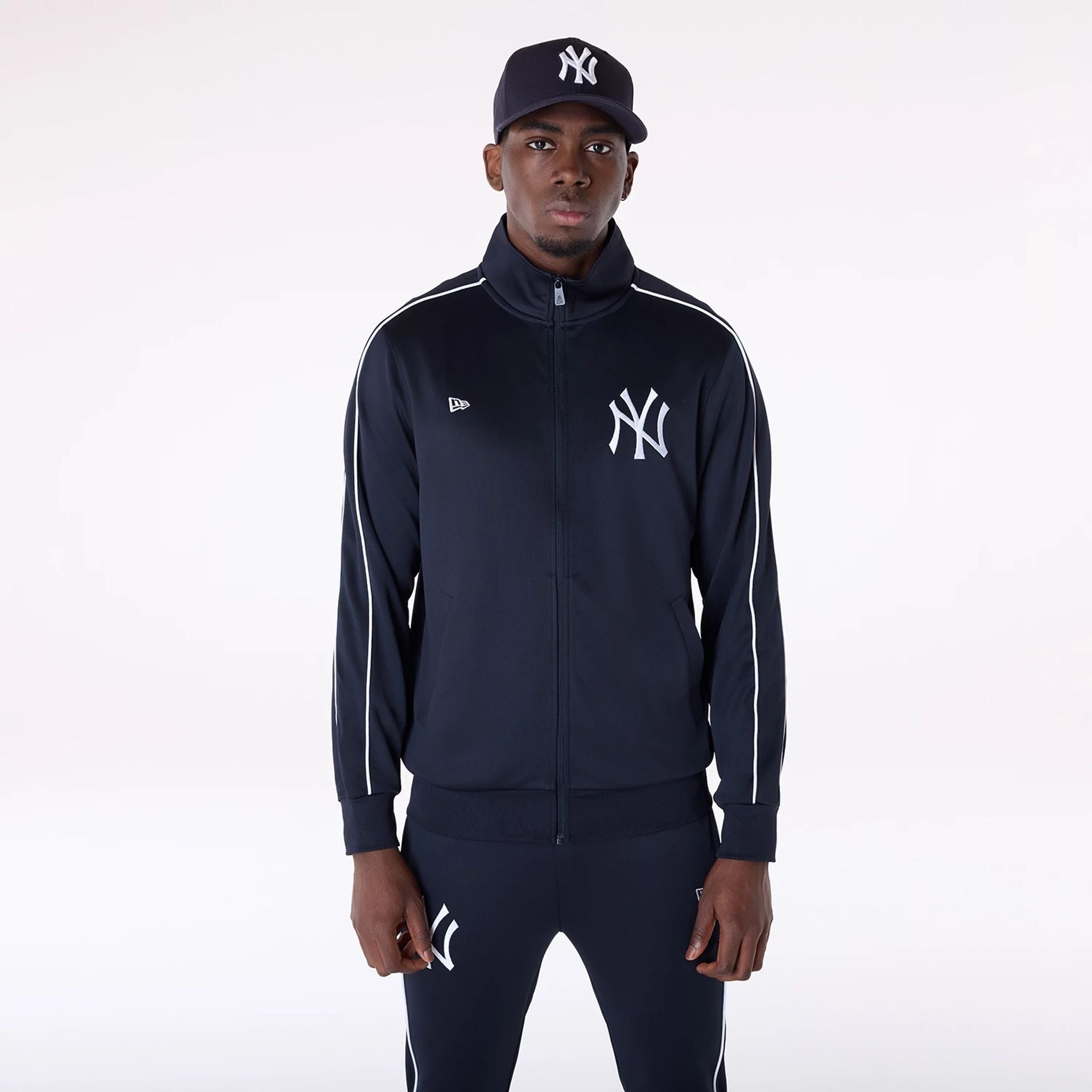 The Male model is wearing New York Yankees MLB Poly Track Set Navy Track Suit 2