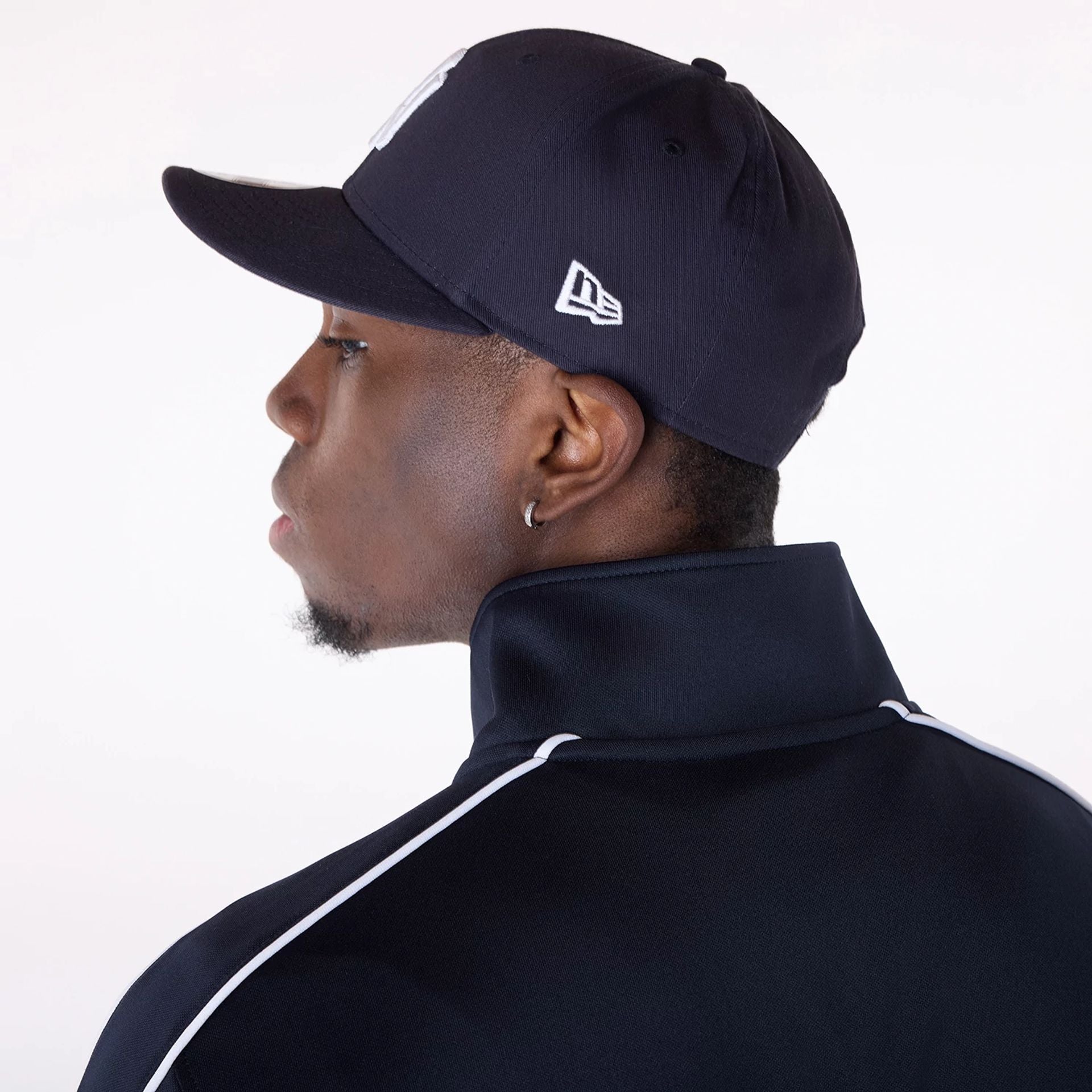 The Male model is wearing New York Yankees MLB Track Top Navy Track Jacket 7