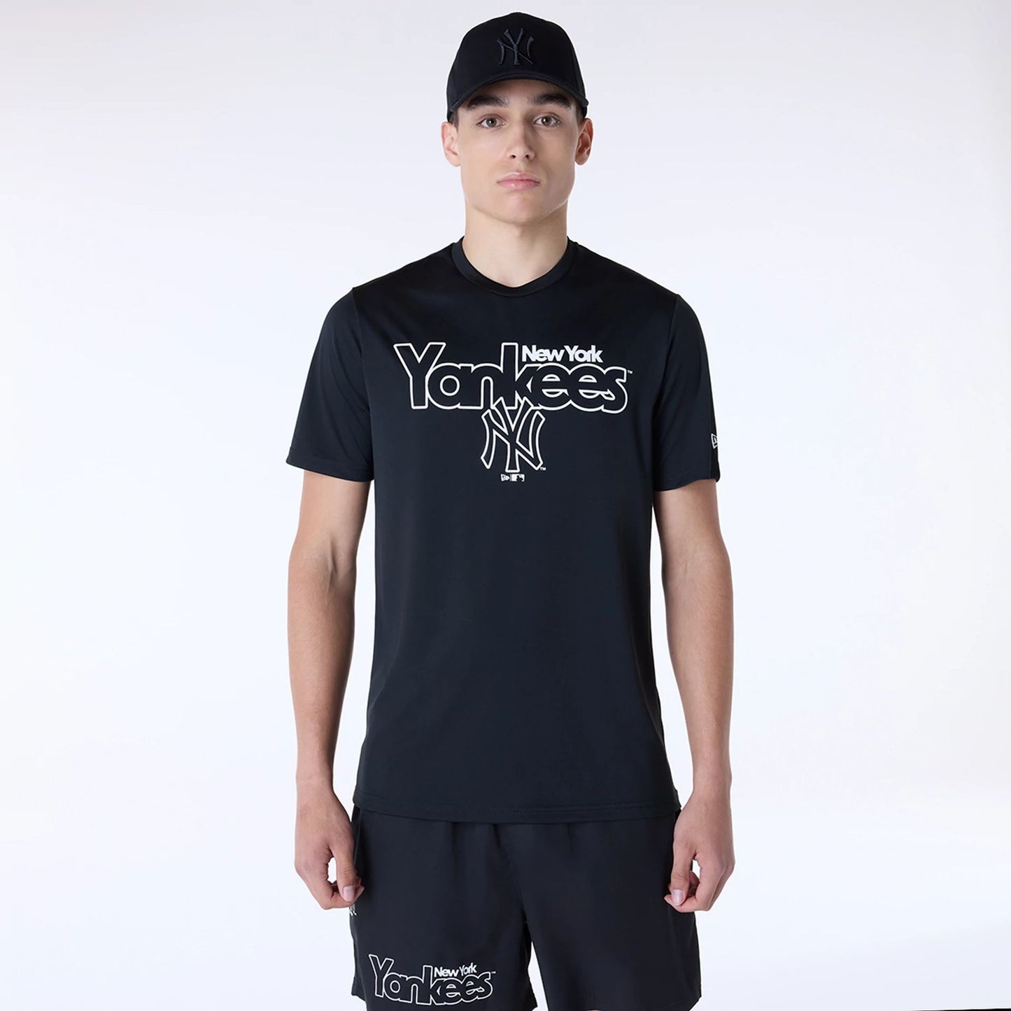 The Male model is wearing New York Yankees MLB Essential Black Top And Shorts Set 4