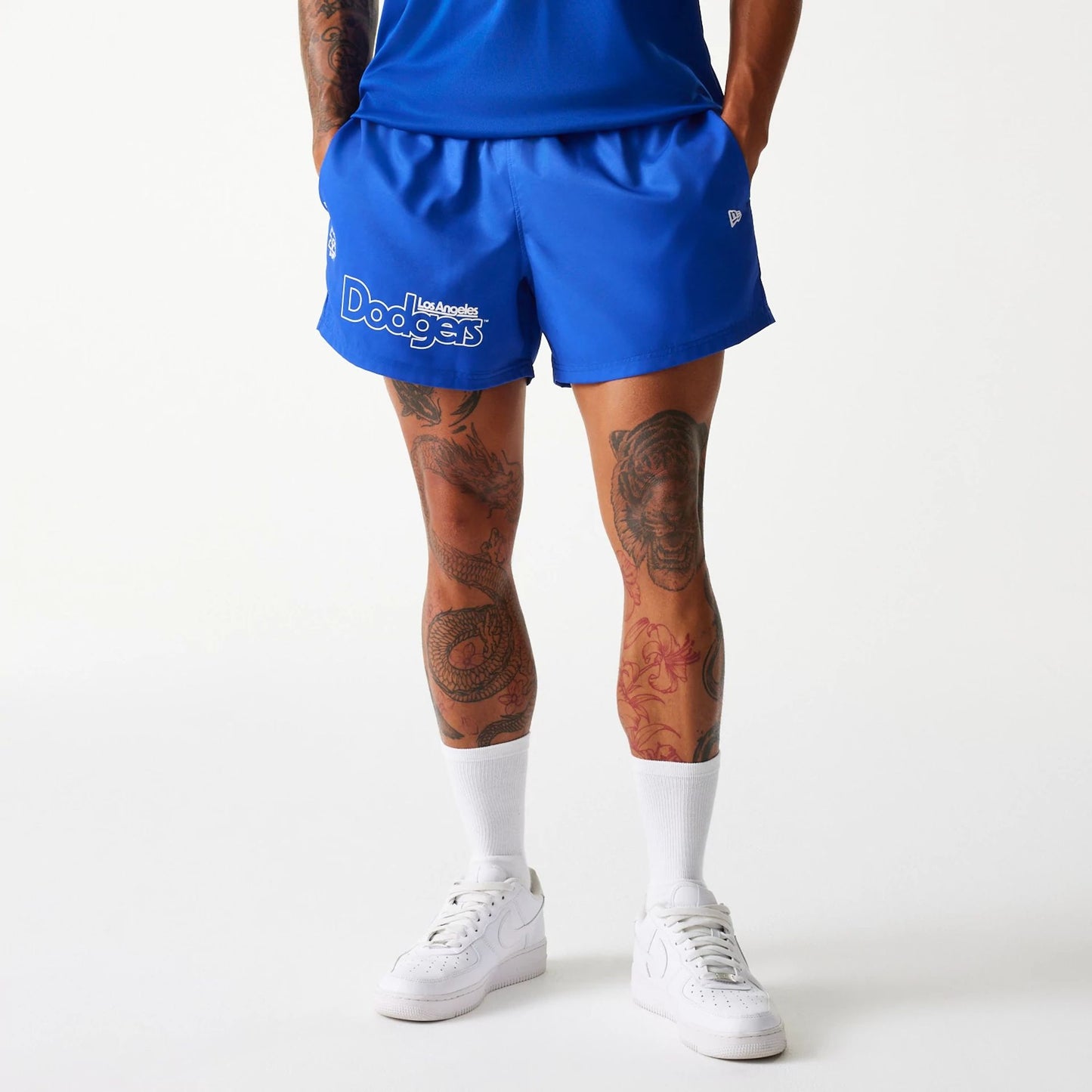 The Male model is wearing LA Dodgers MLB Essentials Blue Shorts 1