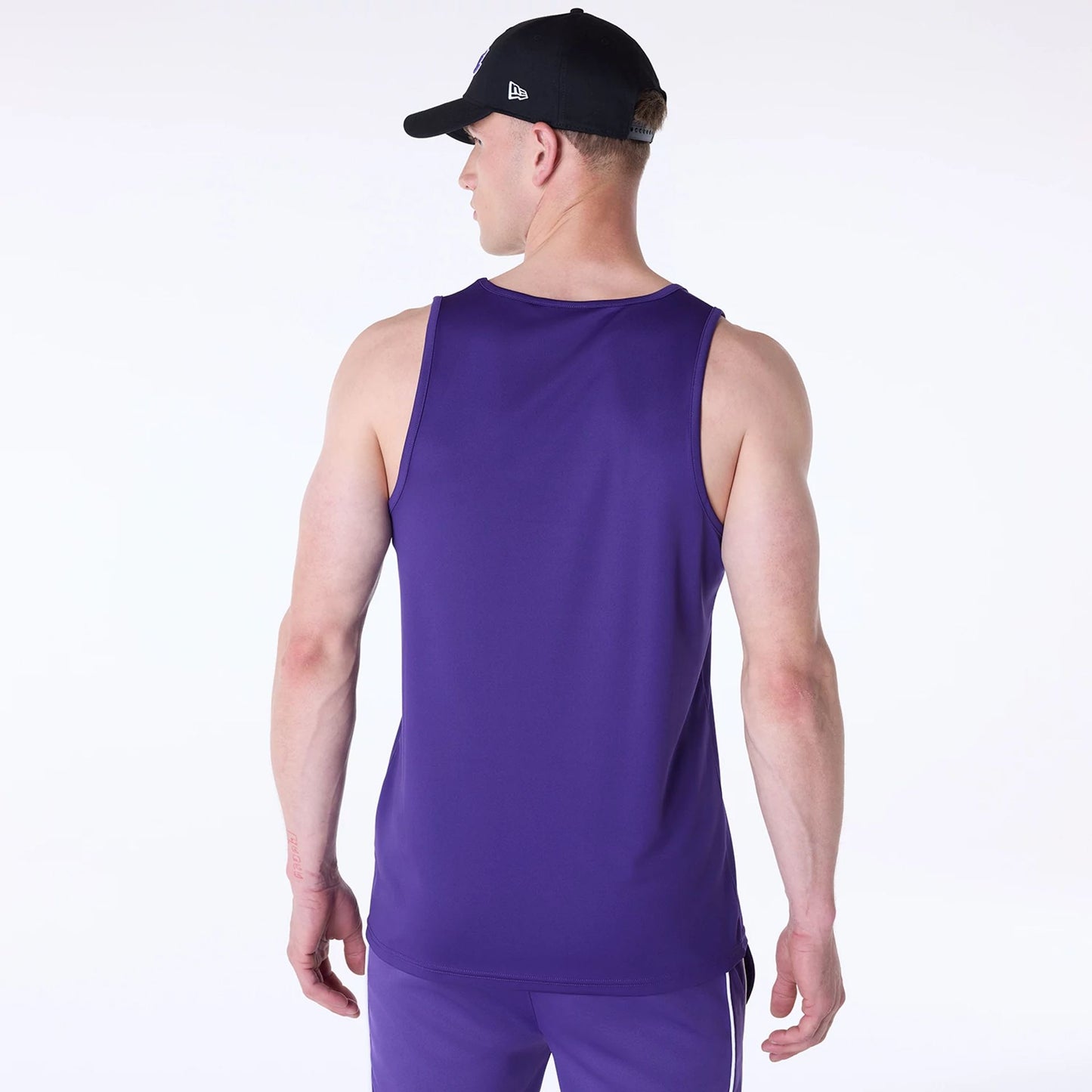 The Male model is wearing LA Lakers NBA Essentials Purple Vest 2