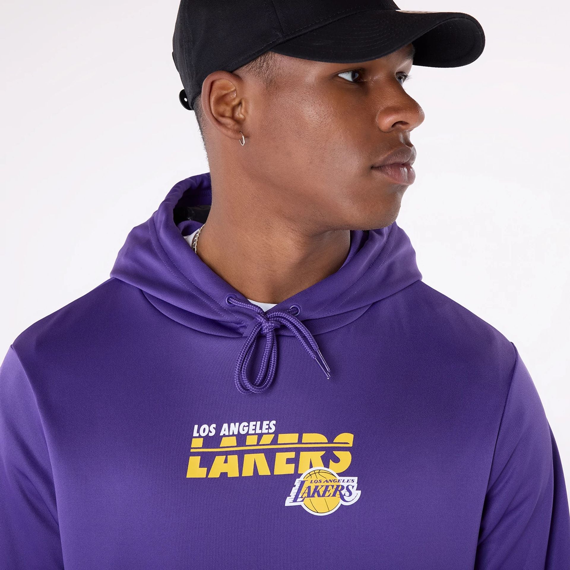 The Male model is wearing LA Lakers NBA Essentials Purple Pullover Hoodie 3