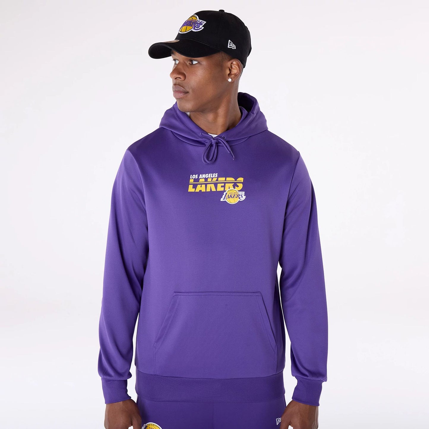 The Male model is wearing LA Lakers NBA Essentials Purple Pullover Hoodie 1