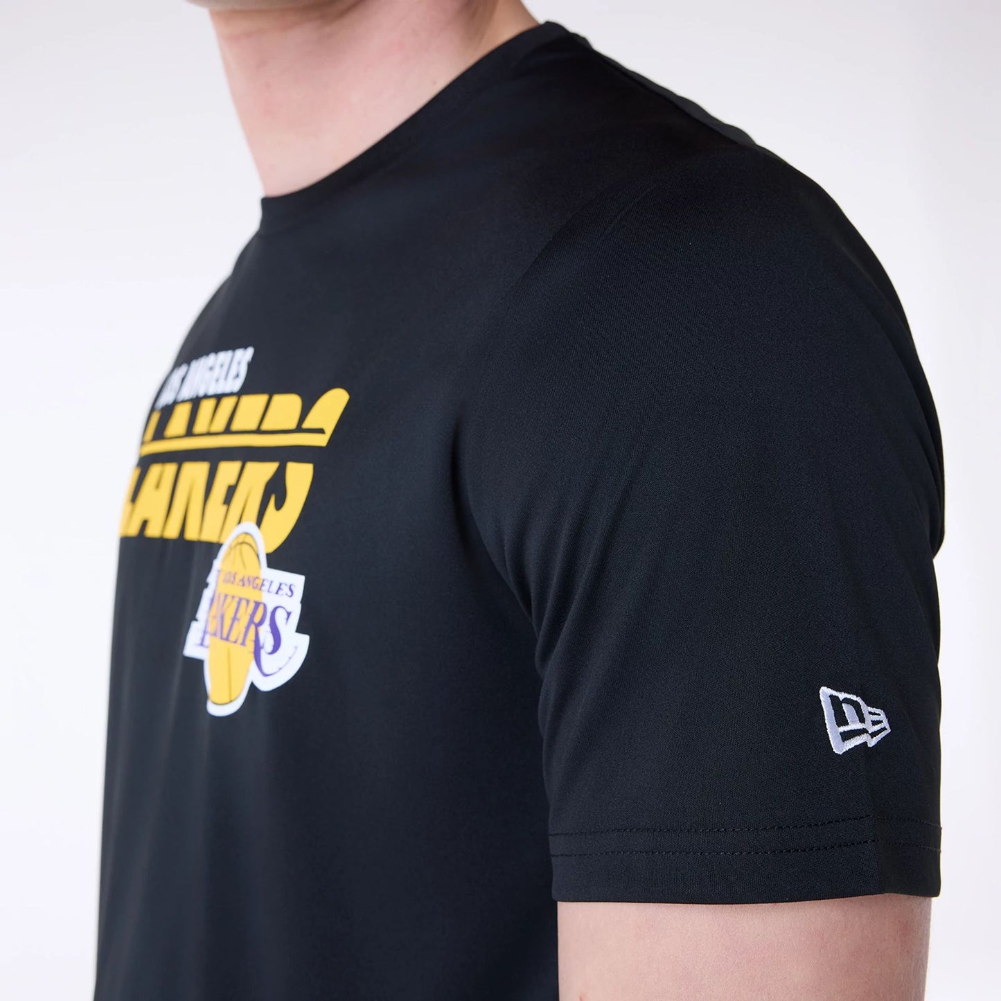 The Male model is wearing LA Lakers NBA Essentials Black T-Shirt 3