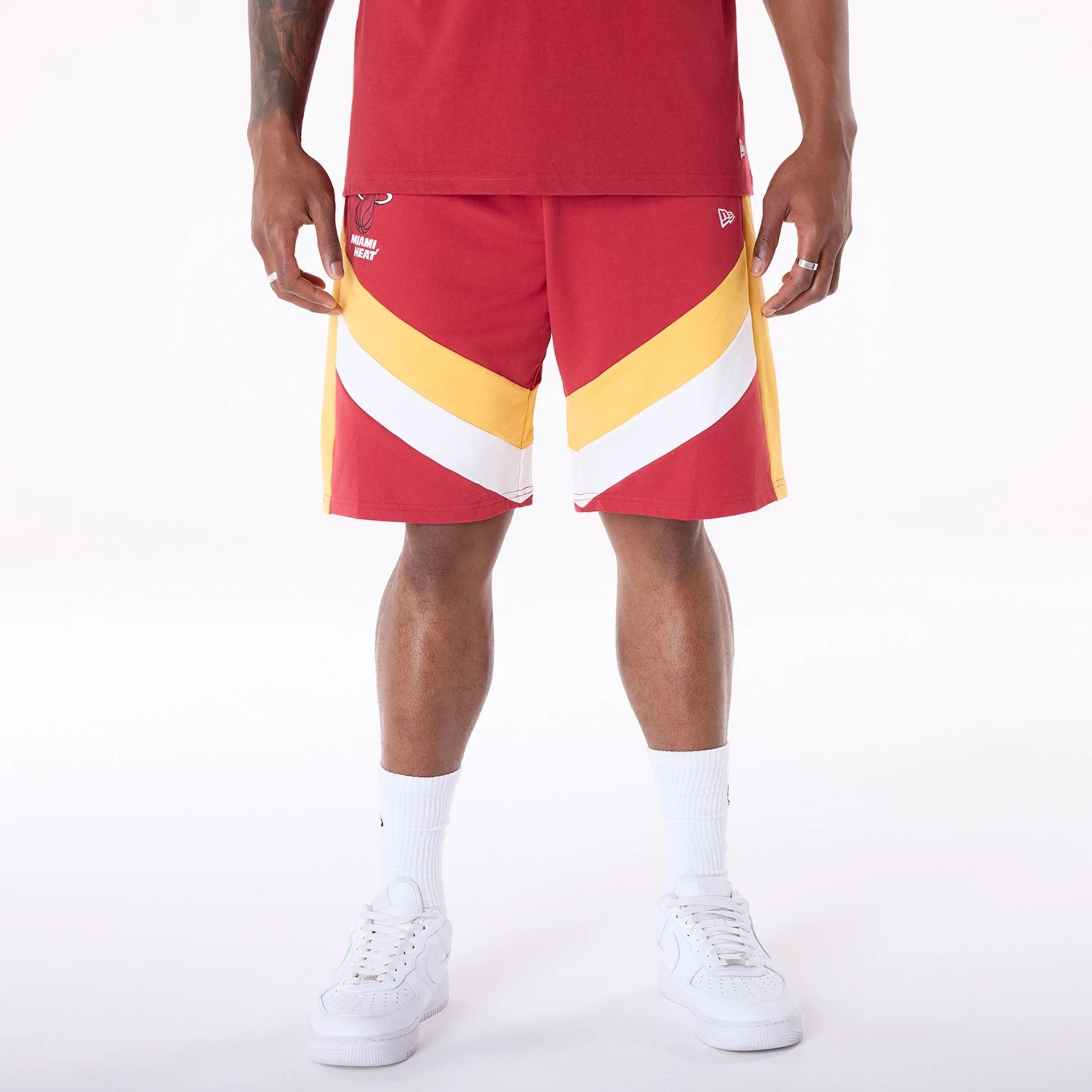 The Male model is wearing Miami Heat NBA Panel Dark Red Shorts 1