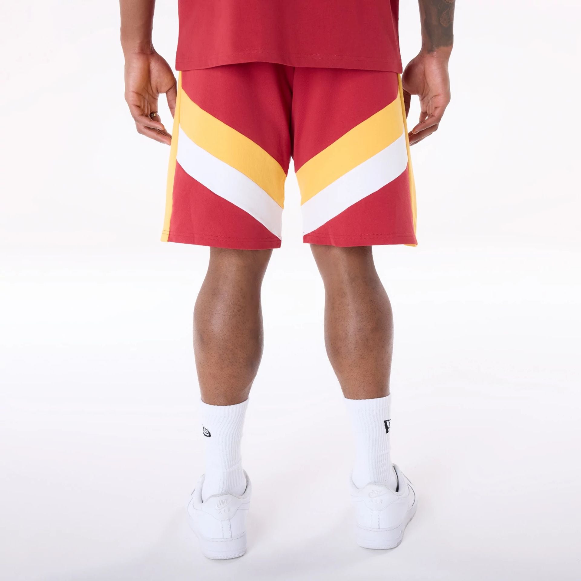 The Male model is wearing Miami Heat NBA Panel Dark Red Shorts 2