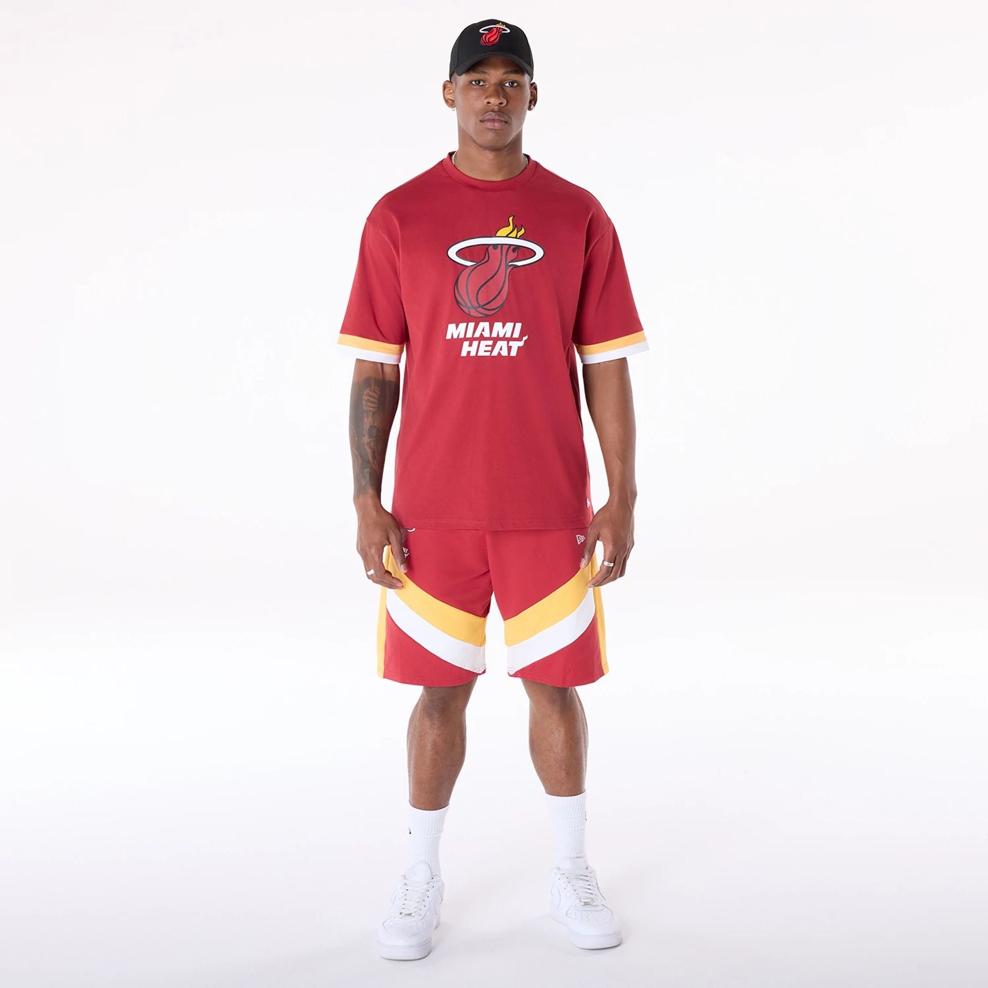 The Male model is wearing Miami Heat NBA Panel Dark Red Shorts 8