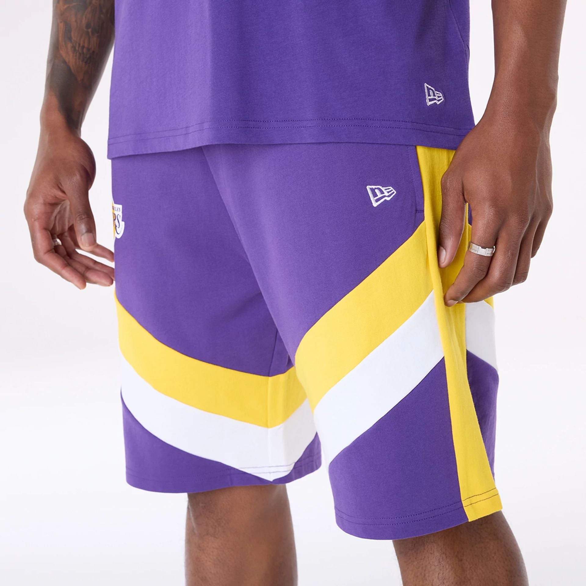 The Male model is wearing LA Lakers NBA Panel Purple Shorts 5