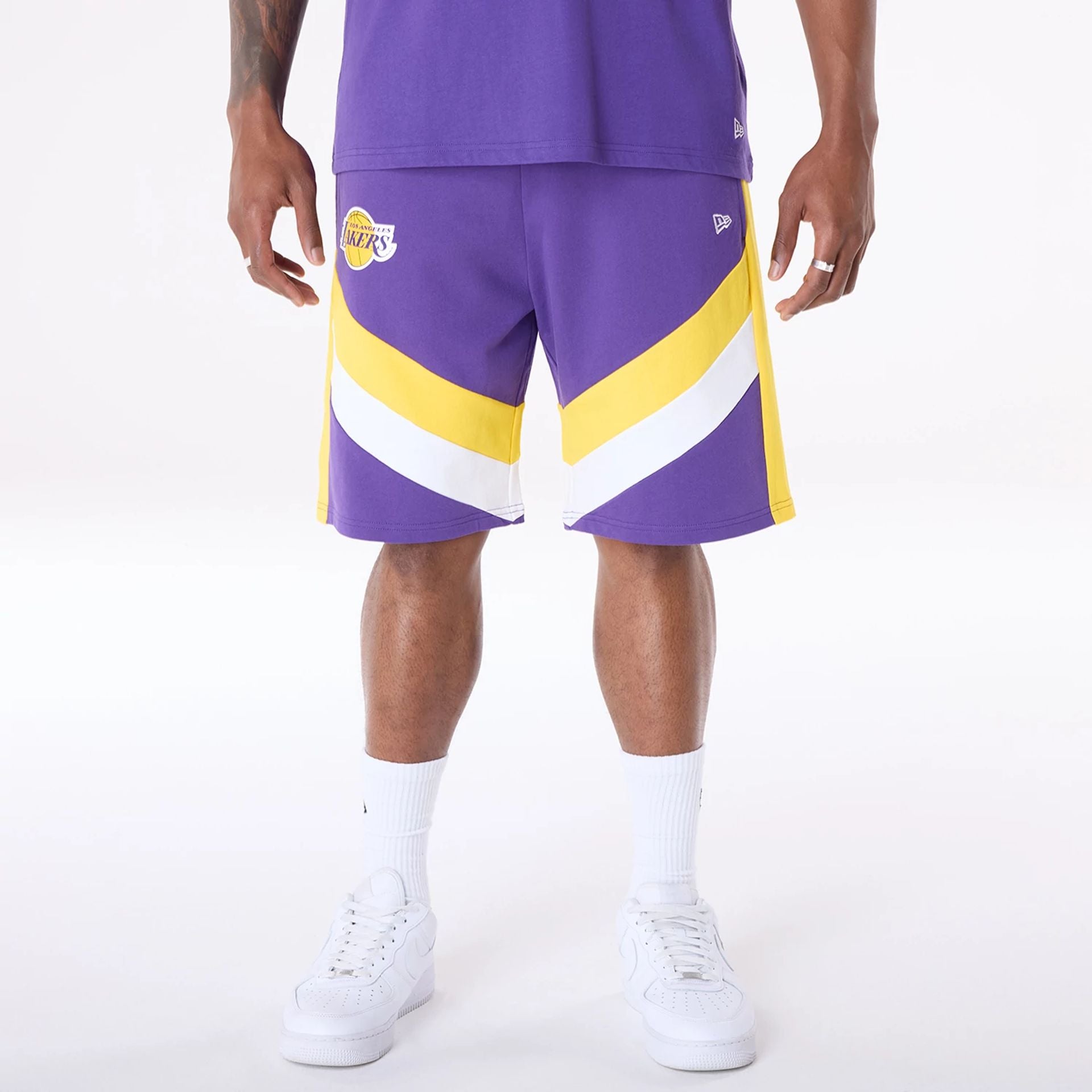 The Male model is wearing LA Lakers NBA Panel Purple Shorts 1