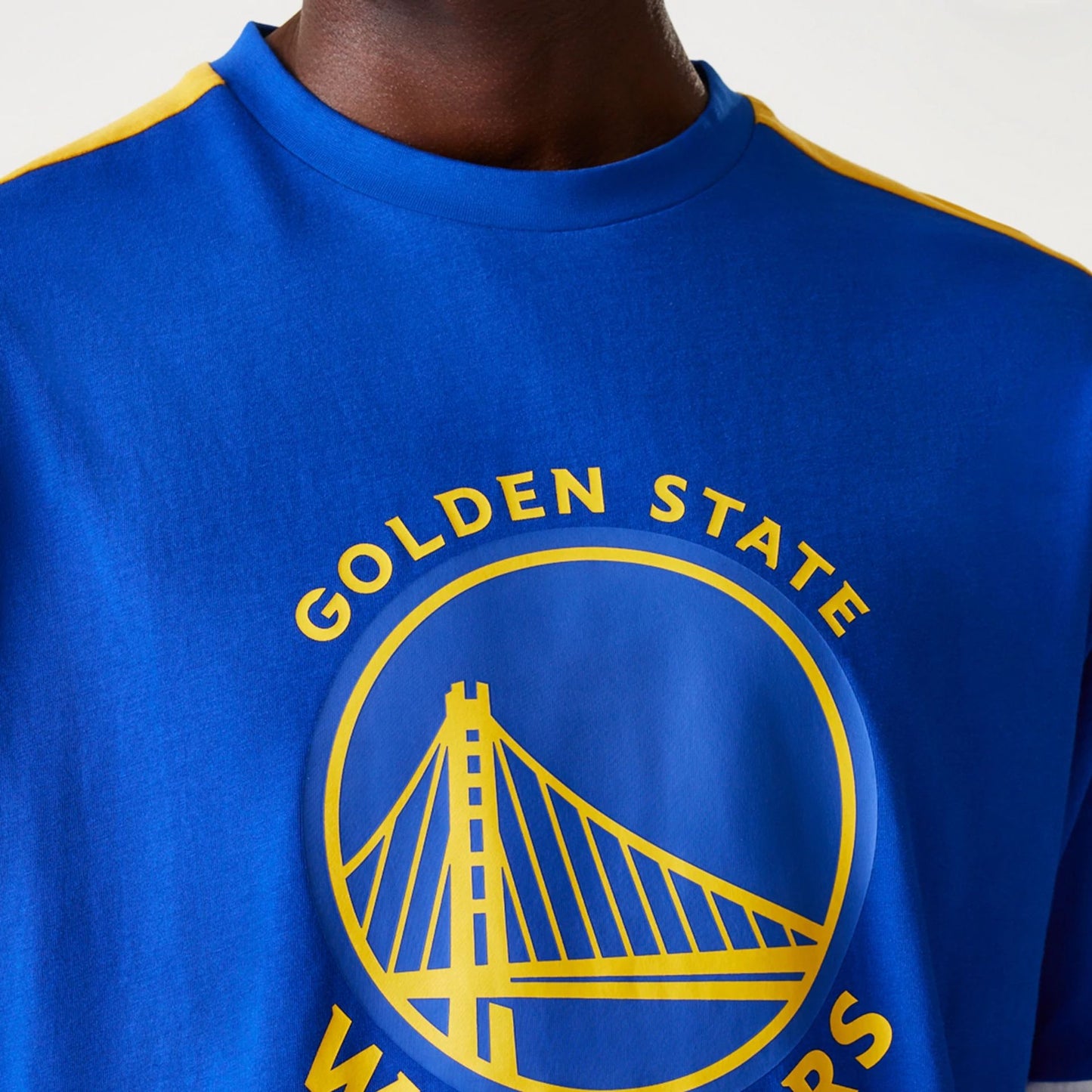 The Male model is wearing Golden State Warriors NBA Panel Blue Oversized T-Shirt 4