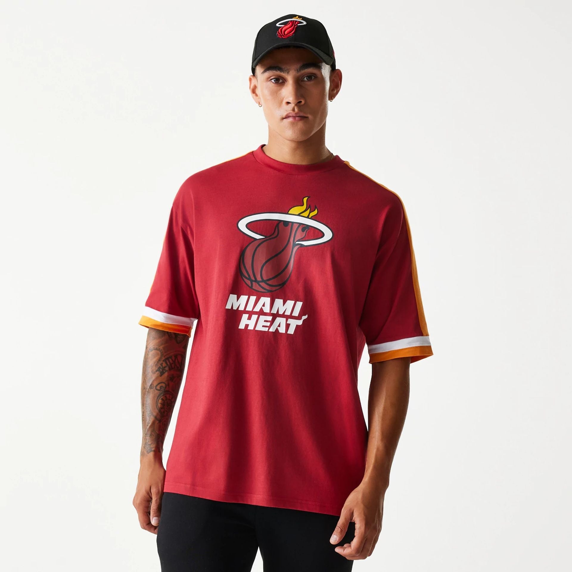 The Male model is wearing Miami Heat NBA Panel Dark Red Oversized T-Shirt 1