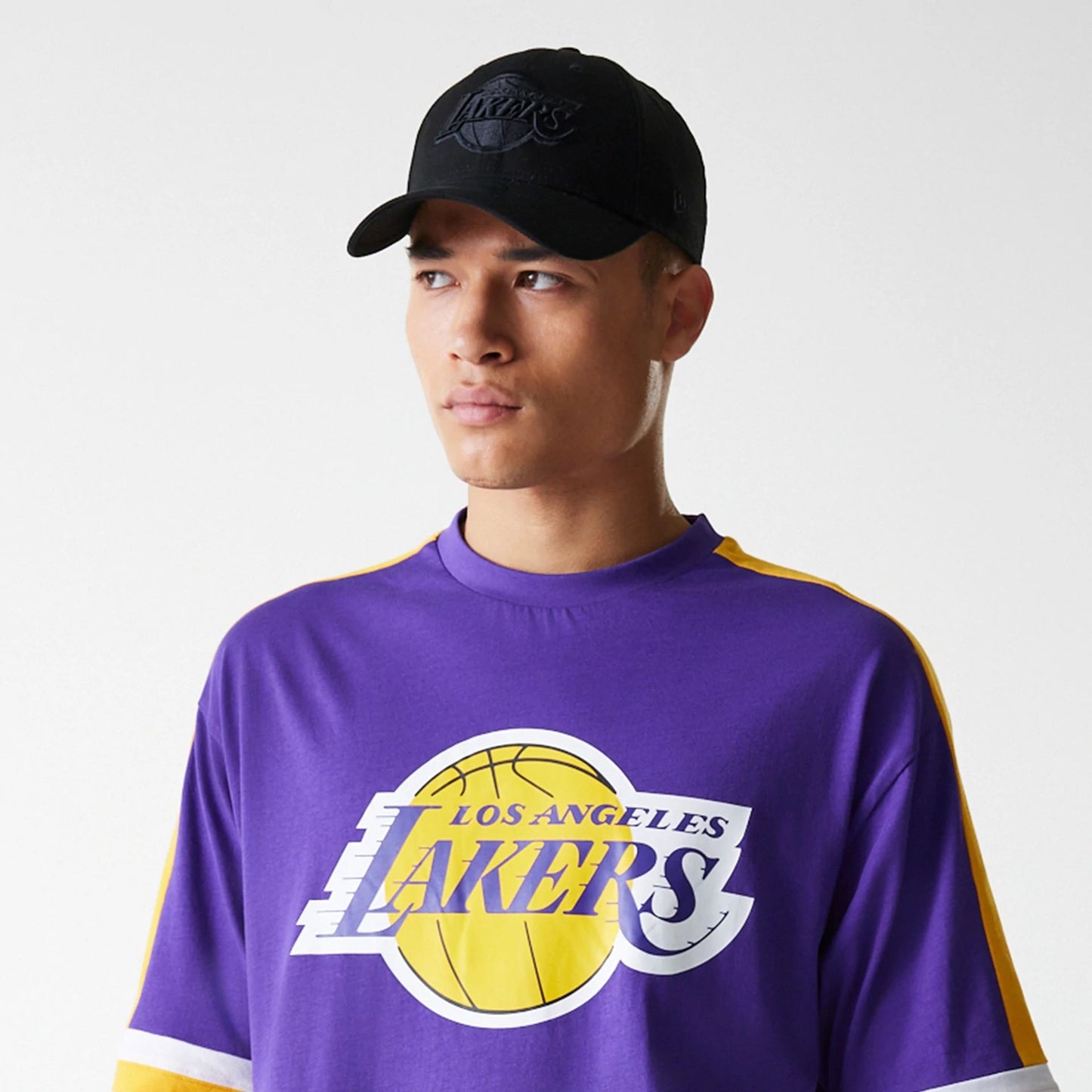 The Male model is wearing LA Lakers NBA Panel Purple Oversized T-Shirt 5