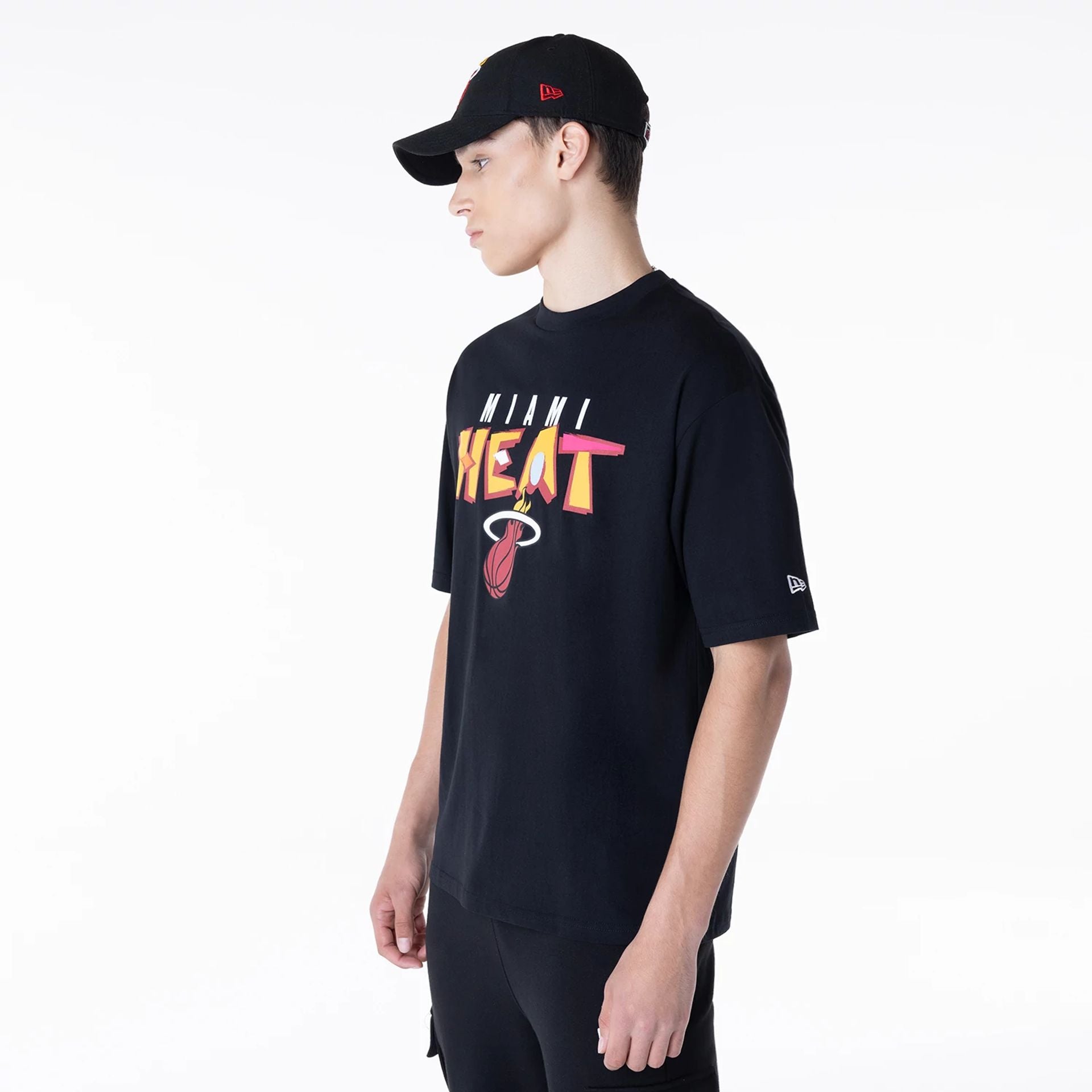 The Male model is wearing Miami Heat NBA Graphic Black Oversized T-Shirt 5