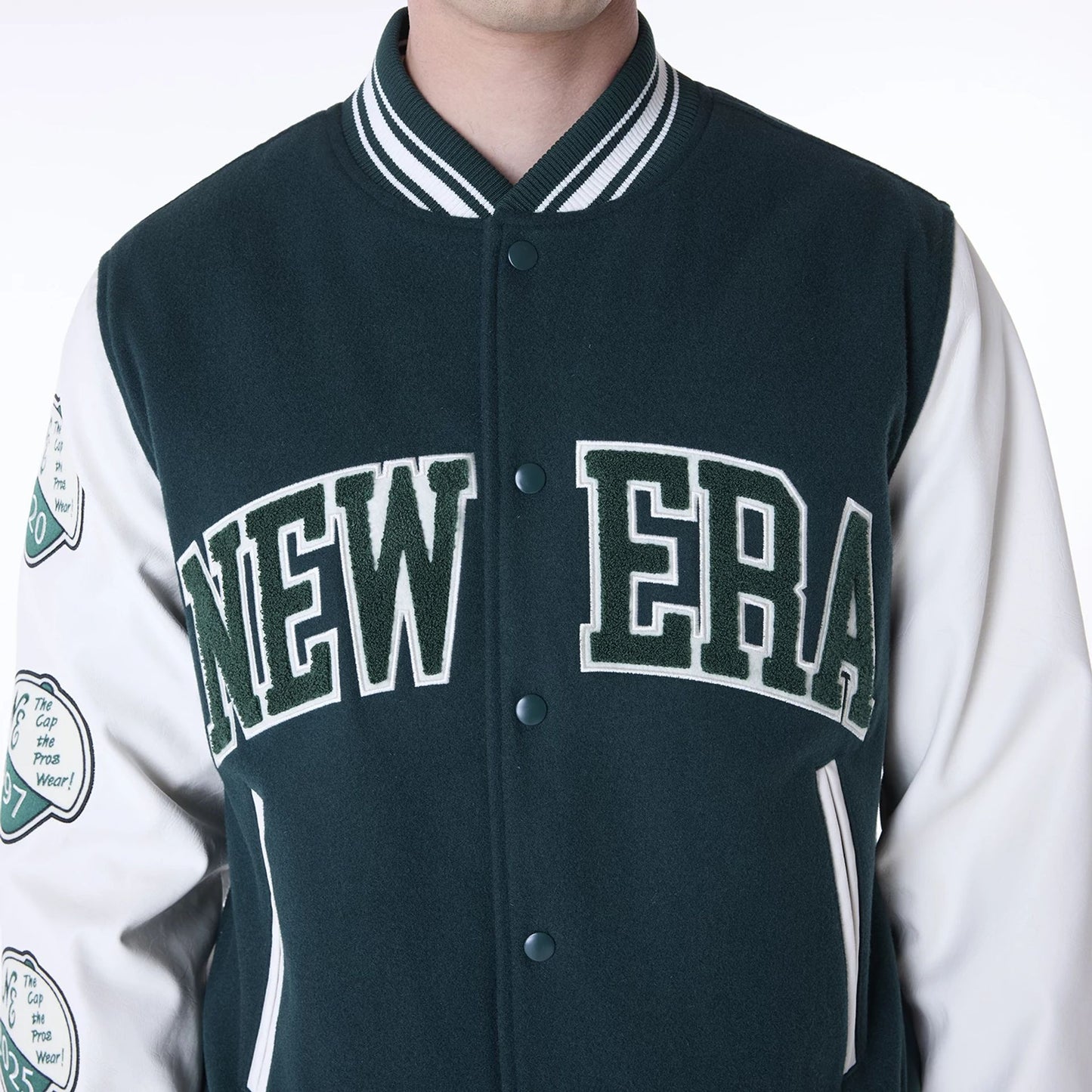 The Male model is wearing New Era Patch Dark Green Varsity Jacket 7