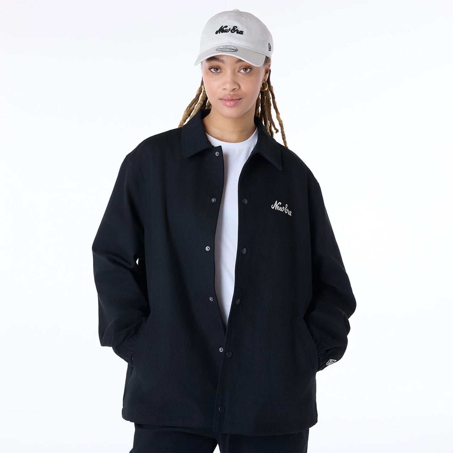 The Male model is wearing New Era Essential Black Coaches Jacket 4