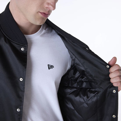 The Male model is wearing New Era Essential Black Satin Bomber Jacket 6