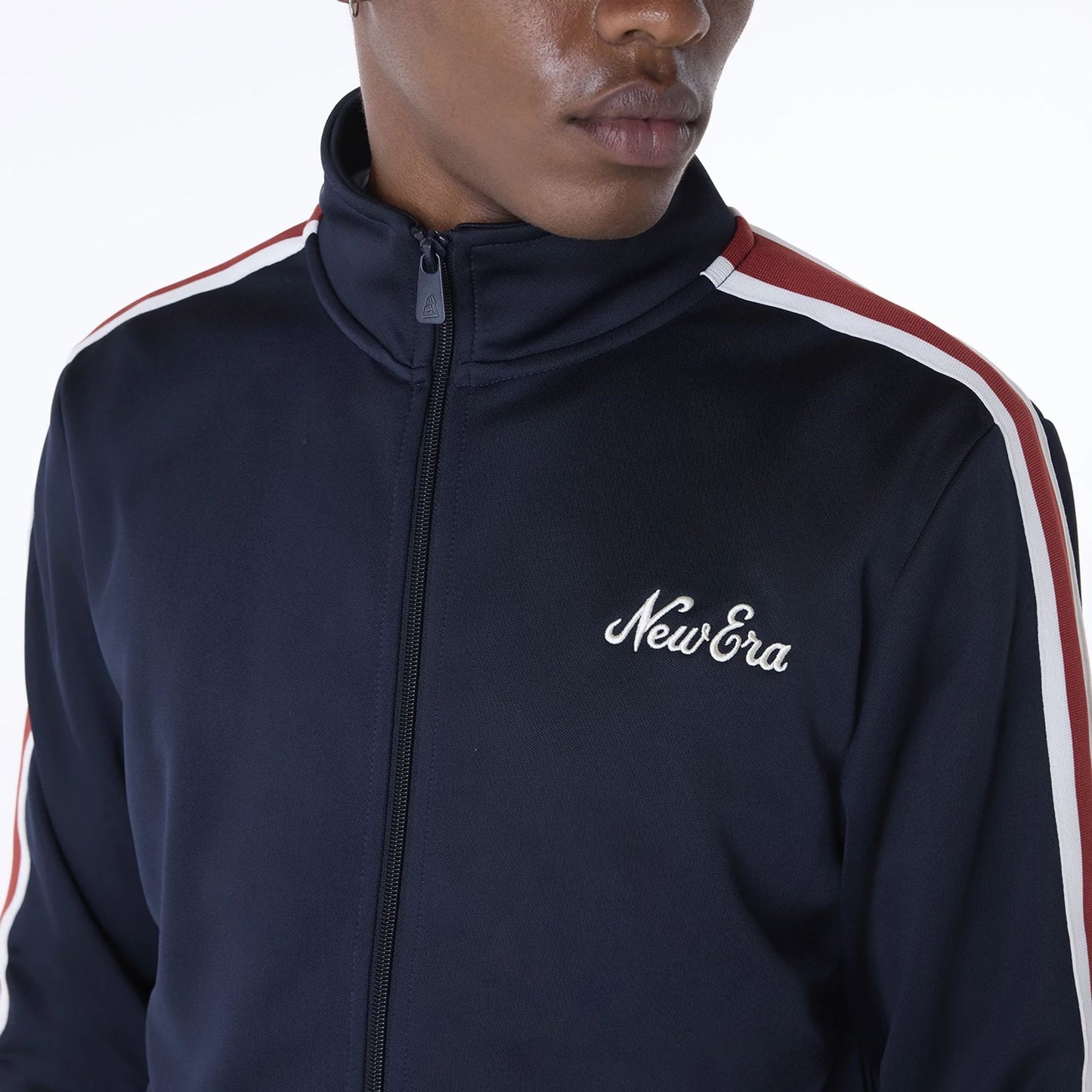 The Male model is wearing New Era Essential Navy Track Jacket 7