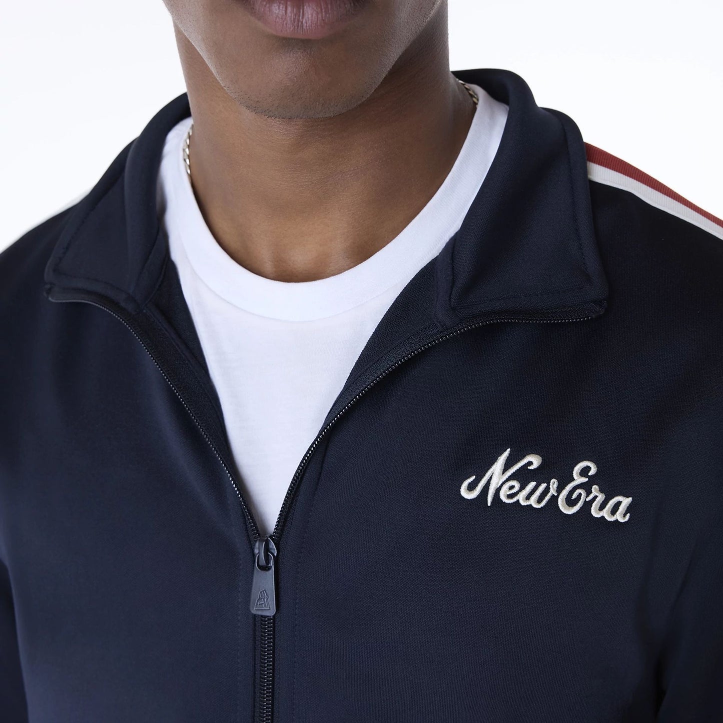 The Male model is wearing New Era Essential Navy Track Jacket 3