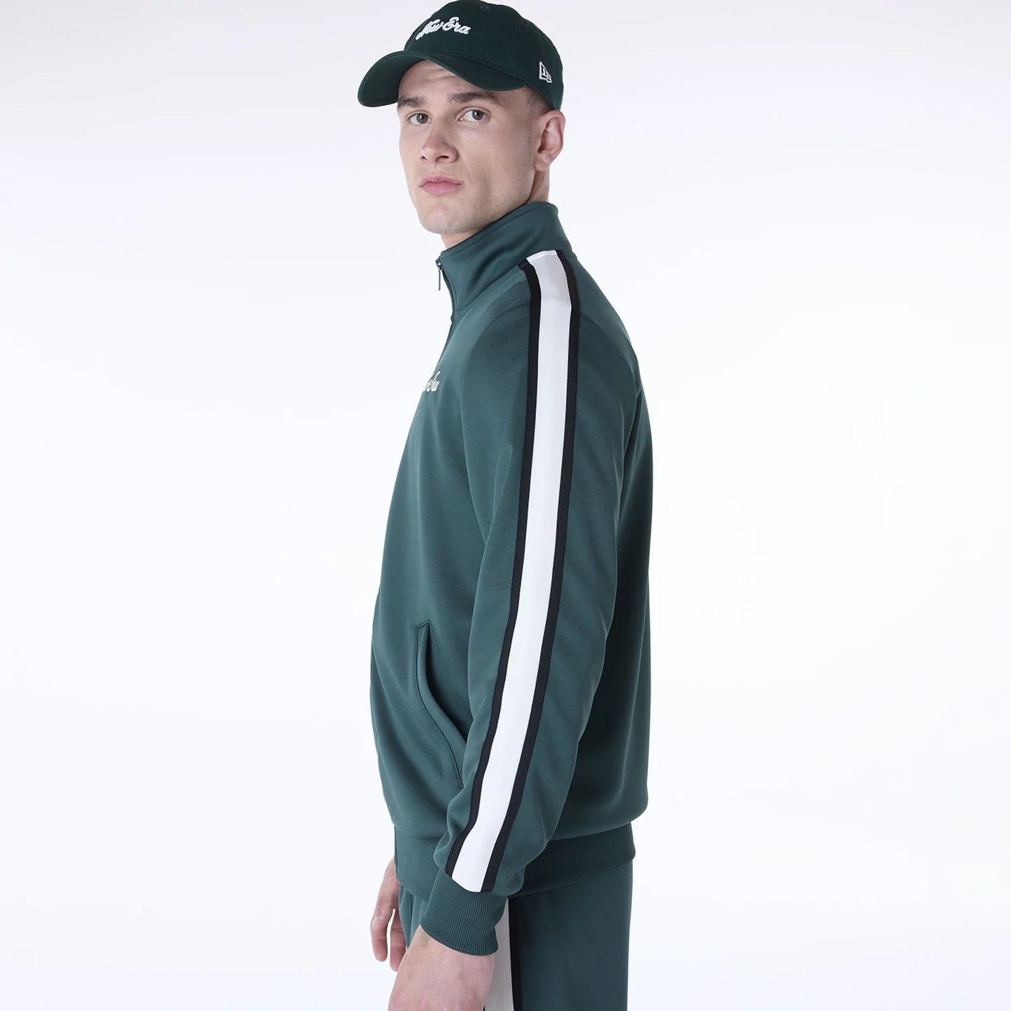 The Male model is wearing New Era Essential Dark Green Track Jacket 6