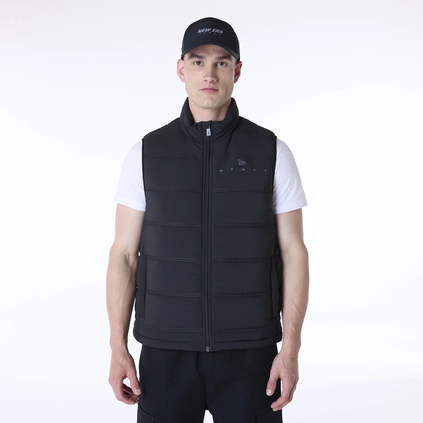 The Male model is wearing New Era Essential Black Padded Gilet 1