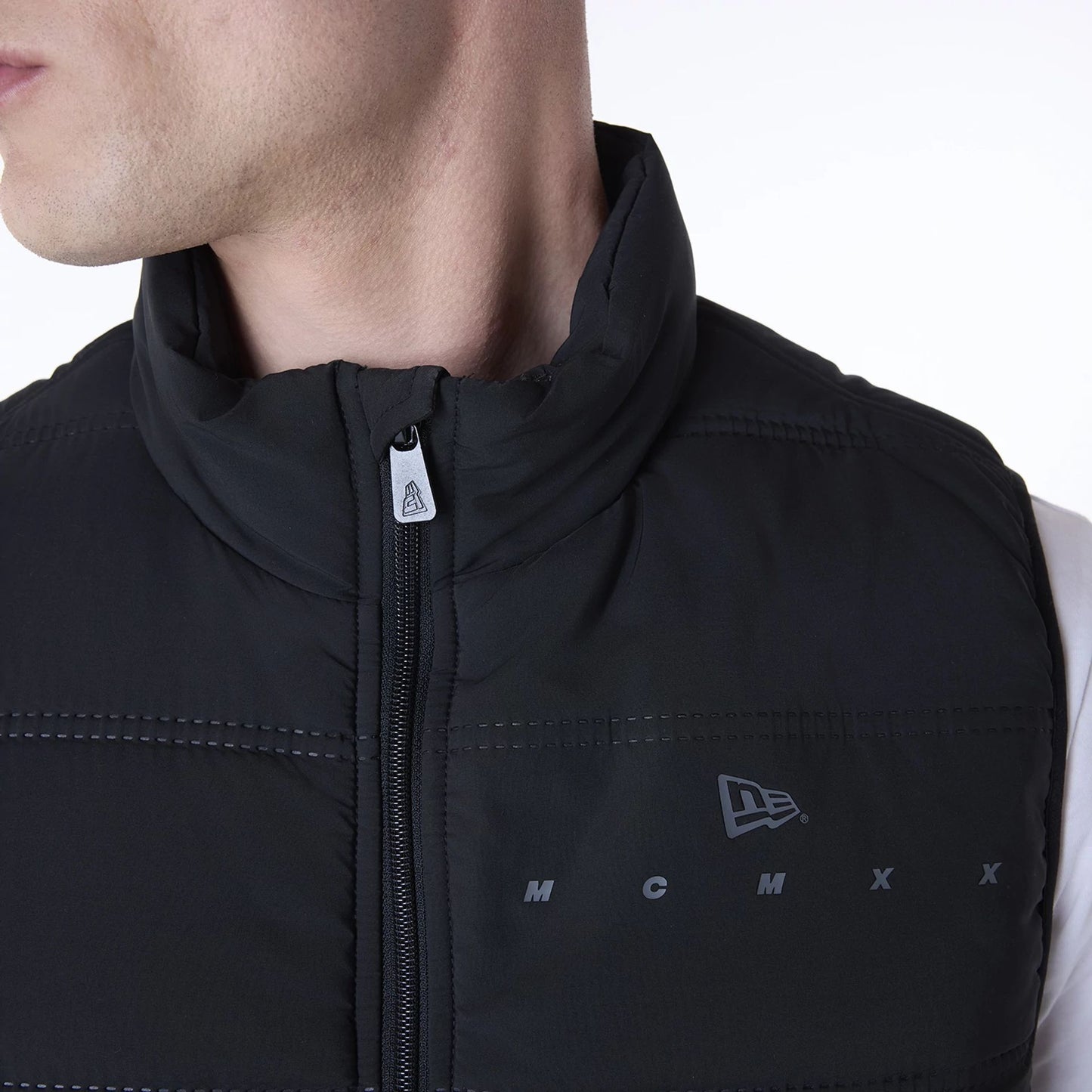 The Male model is wearing New Era Essential Black Padded Gilet 5