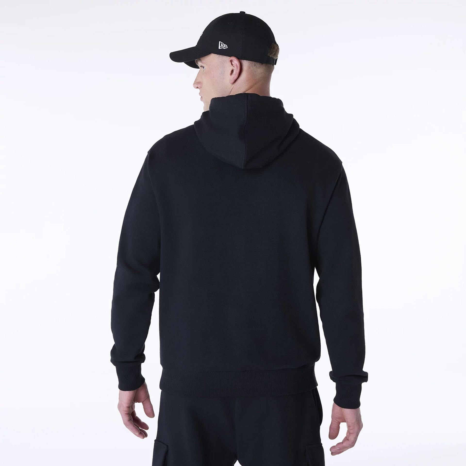 The Male model is wearing New Era Script Black Pullover Hoodie 2