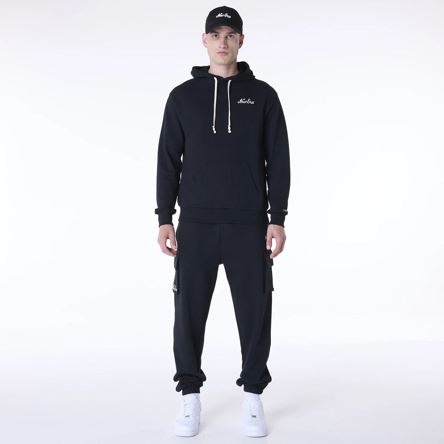 The Male model is wearing New Era Script Black Pullover Hoodie 4