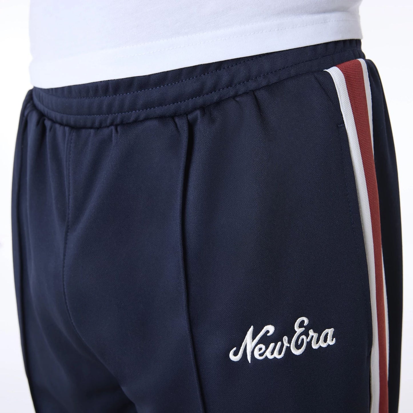 The Male model is wearing New Era Essential Navy Track Pants 7