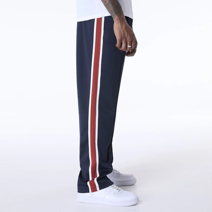 The Male model is wearing New Era Essential Navy Track Pants 5