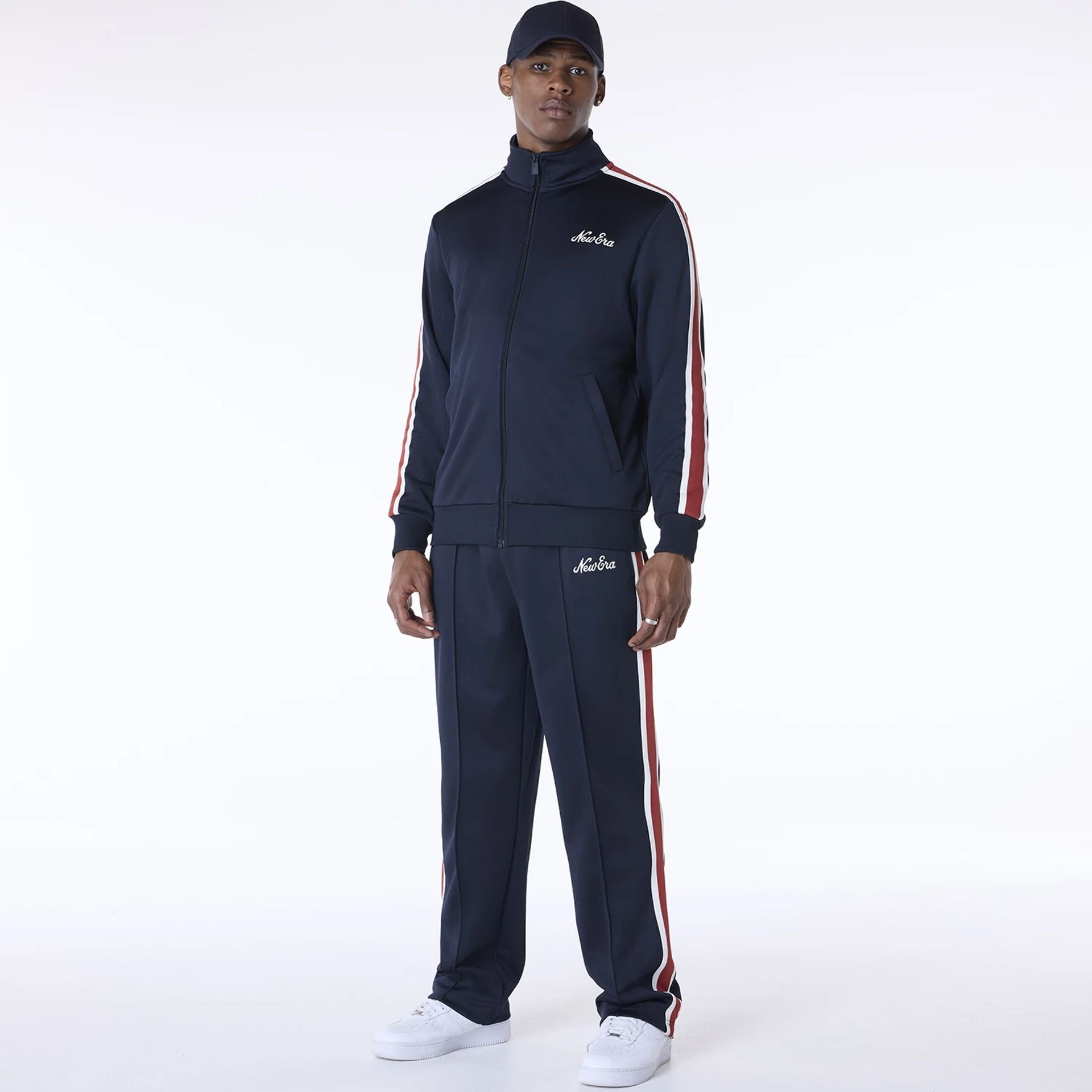 The Male model is wearing New Era Essential Navy Track Pants 8