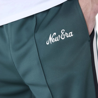 The Male model is wearing New Era Essential Dark Green Track Pants 6