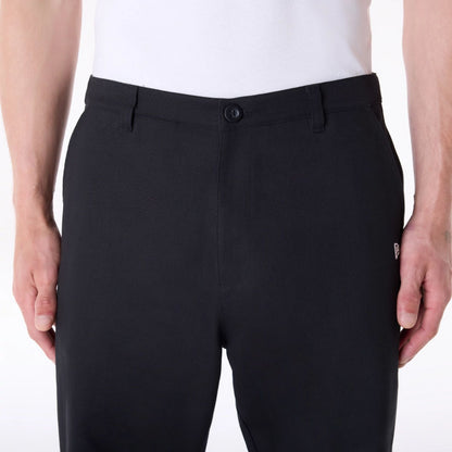 The Male model is wearing New Era Black Chino Trousers 7