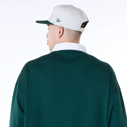 The Male model is wearing New Era Drop Shoulder Dark Green Rugby 5