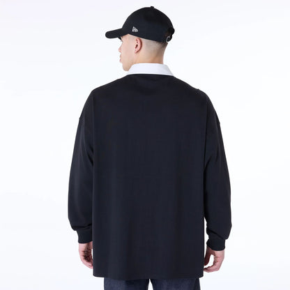 The Male model is wearing New Era Drop Shoulder Black Rugby 2