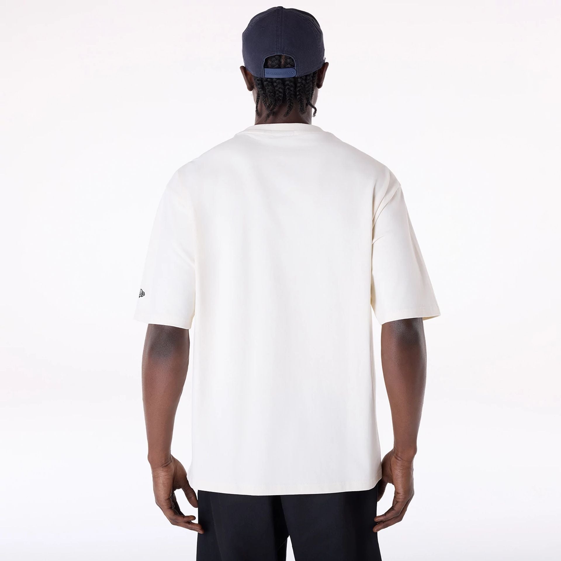 The Male model is wearing New Era Graphic Open White Oversized T-Shirt 2