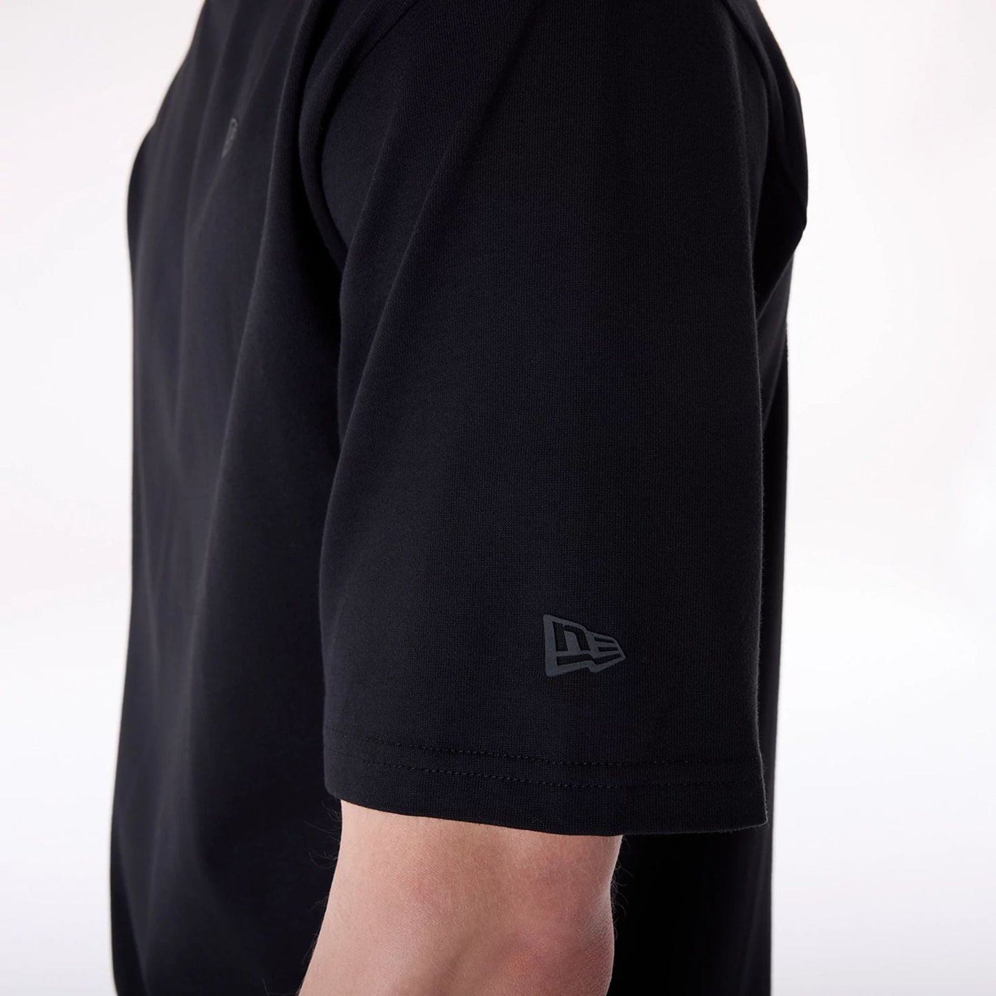 The Male model is wearing New Era Sticker Black Oversized T-Shirt 4