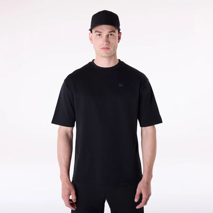 The Male model is wearing New Era Sticker Black Oversized T-Shirt 1