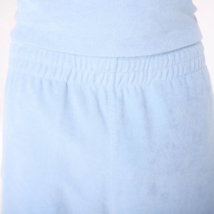 The Male model is wearing New Era Towelling Pastel Blue Shorts 4