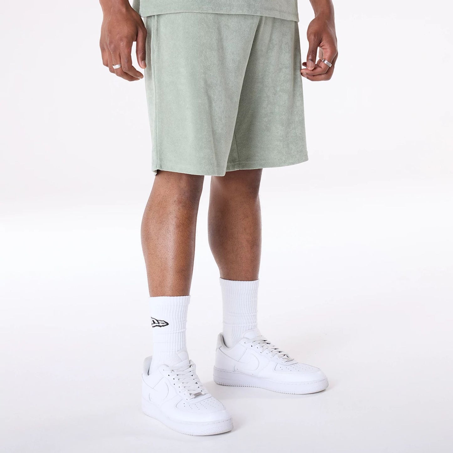 The Male model is wearing New Era Towelling Pastel Green Shorts 5