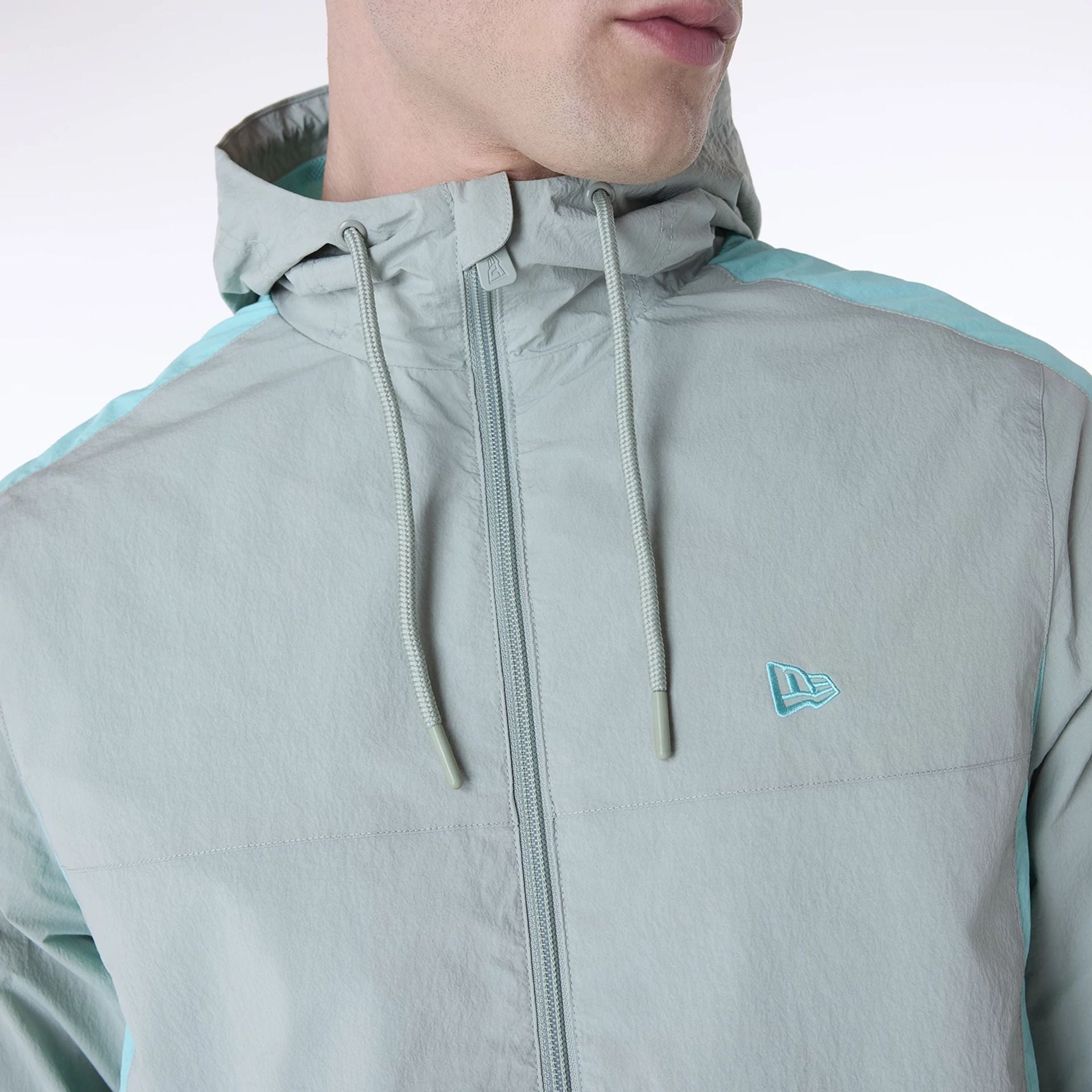 The Male model is wearing New Era Colour Block Pastel Green Jacket 3