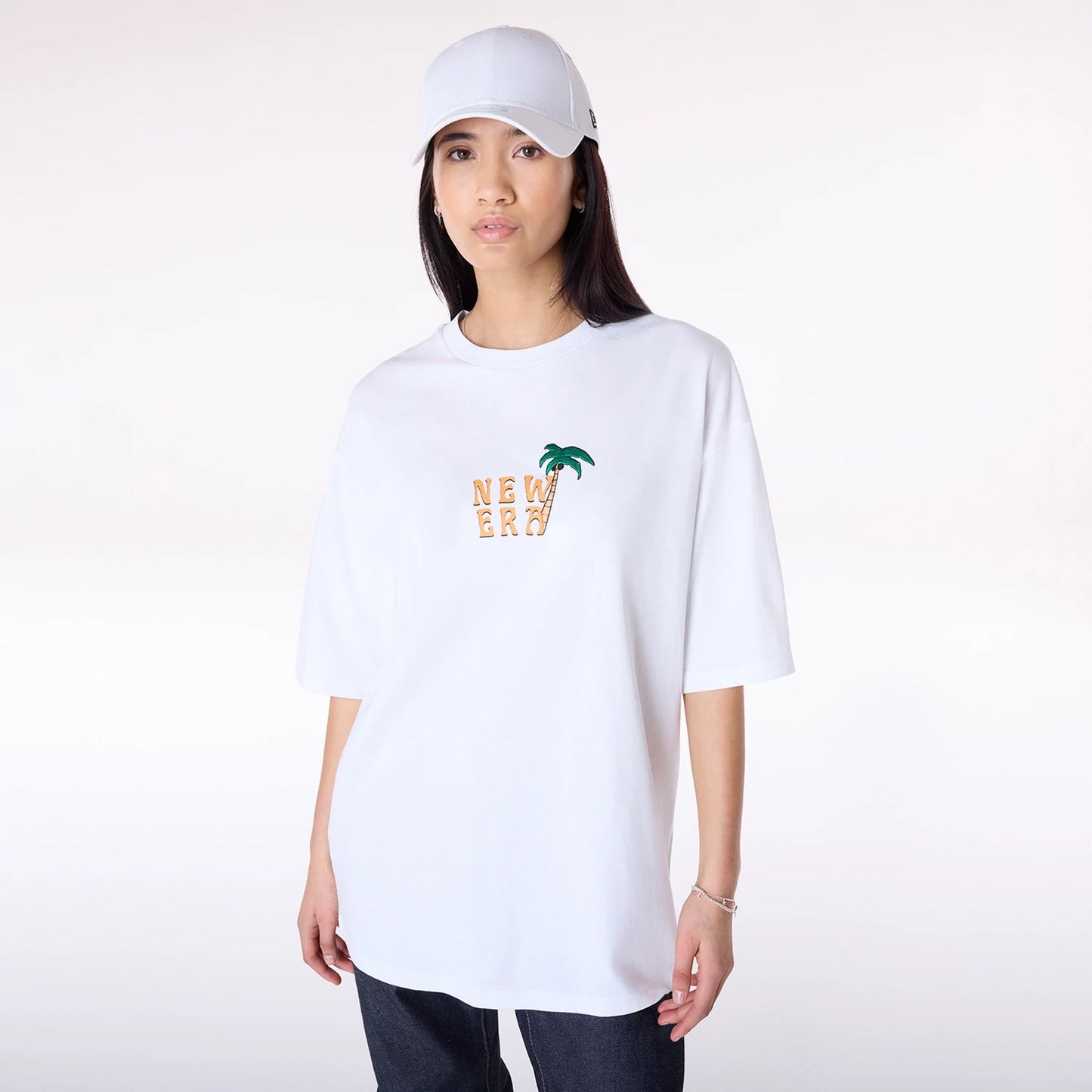 The Male model is wearing New Era Drink Graphic White Oversized T-Shirt 6