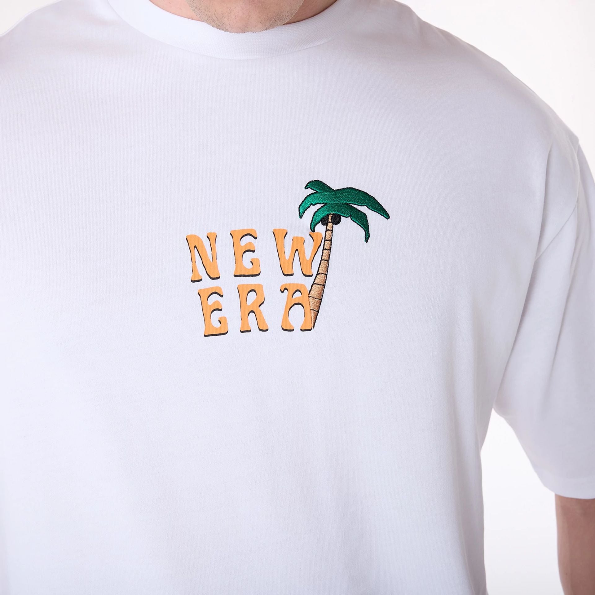 The Male model is wearing New Era Drink Graphic White Oversized T-Shirt 3