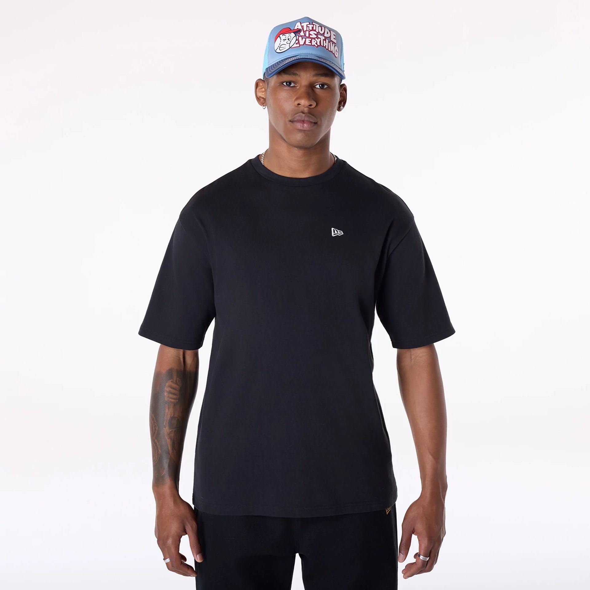 The Male model is wearing New Era Baseball Graphic Black Oversized T-Shirt 1