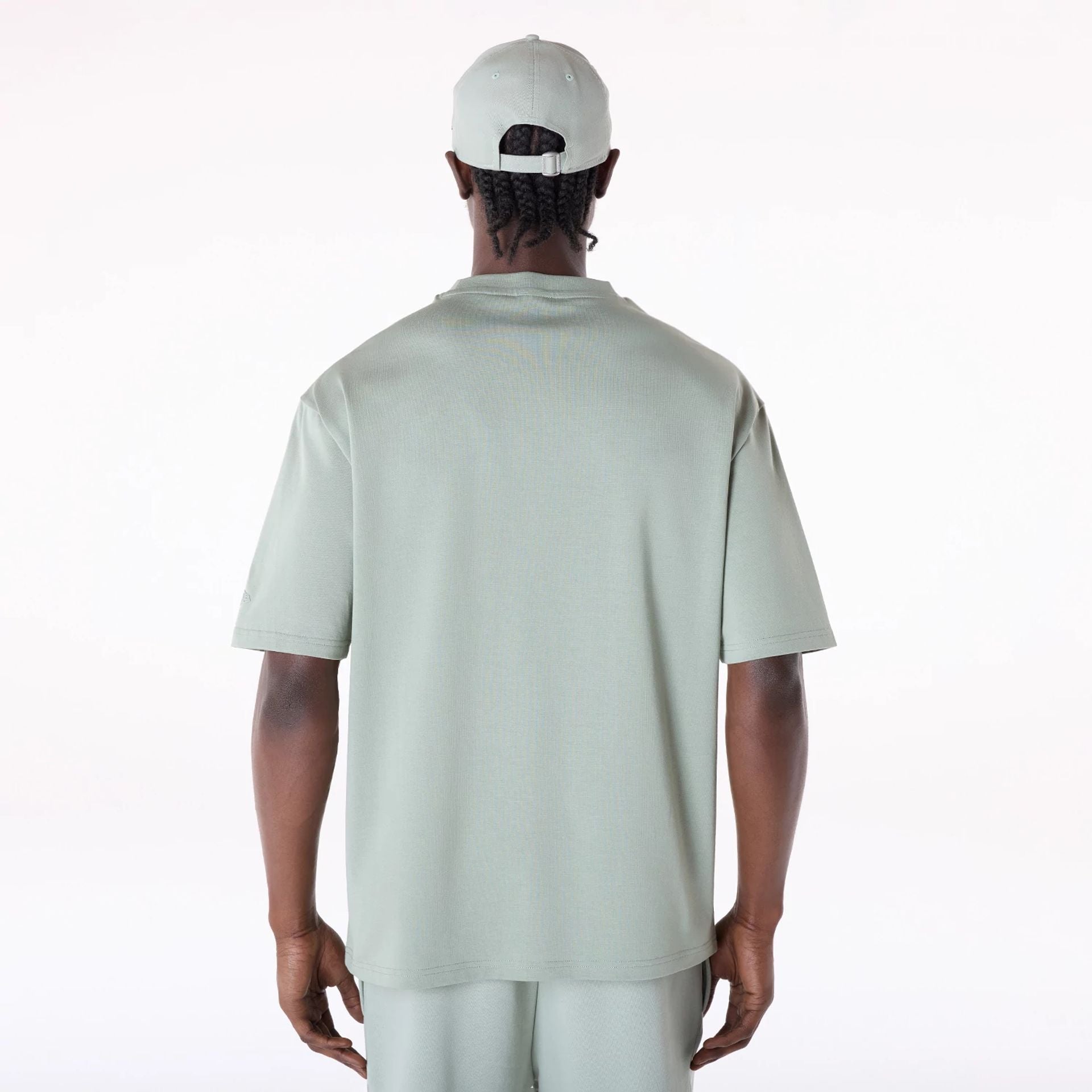 The Male model is wearing New Era Flag Pastel Green Oversized T-Shirt 2