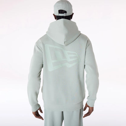 The Male model is wearing New Era Flag Pastel Green Oversized Pullover Hoodie 2