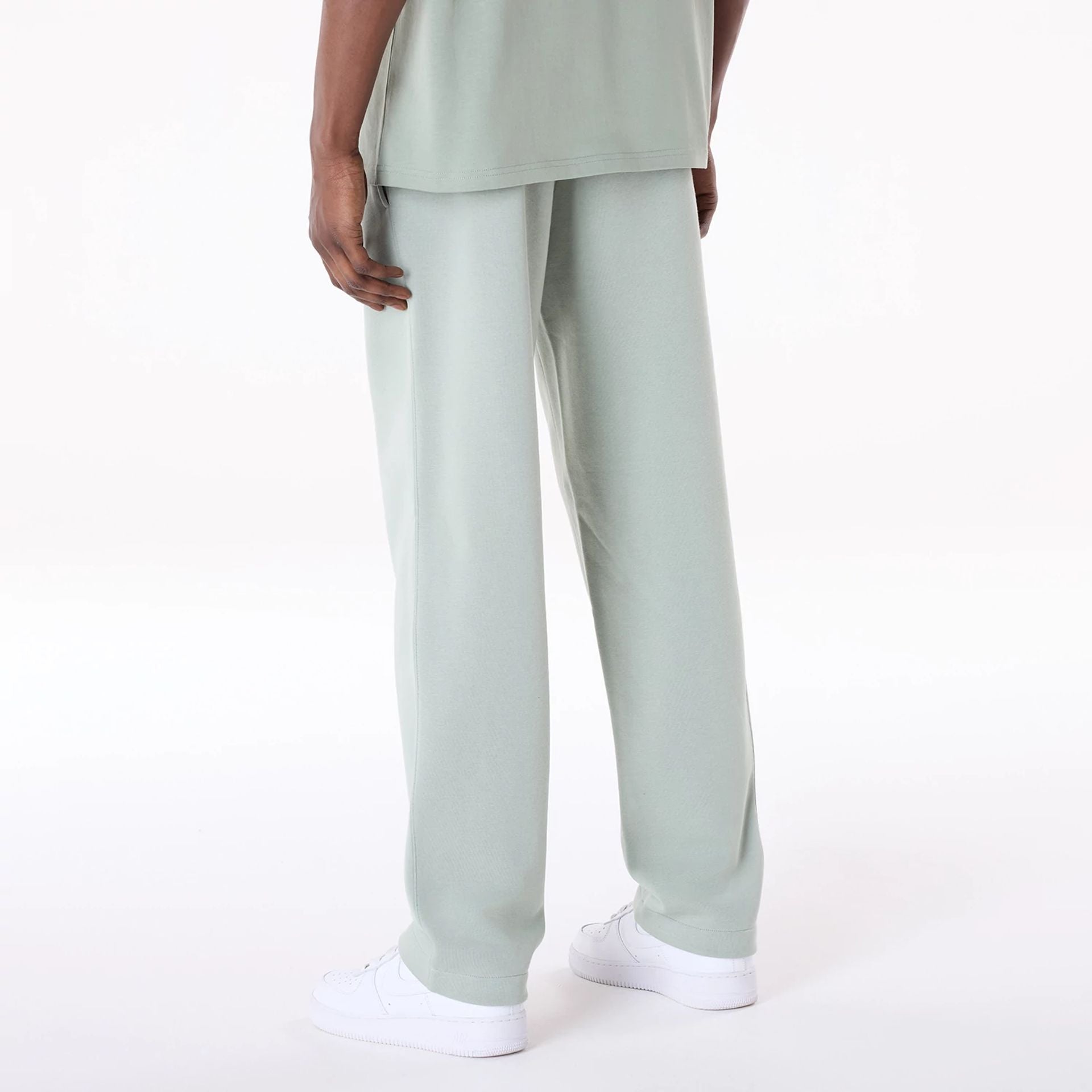 The Male model is wearing New Era Straight Leg Pastel Green Joggers 2