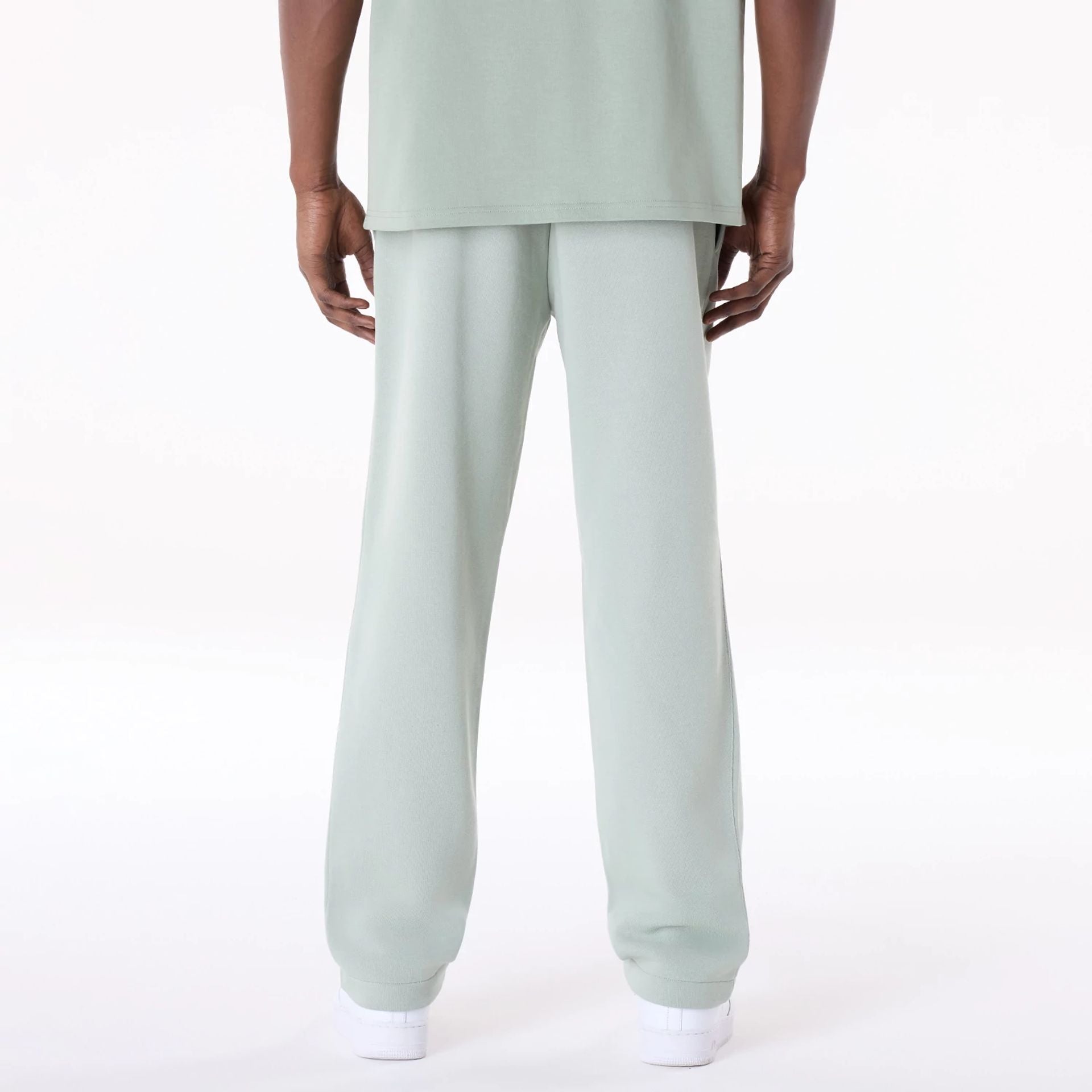 The Male model is wearing New Era Straight Leg Pastel Green Joggers 5