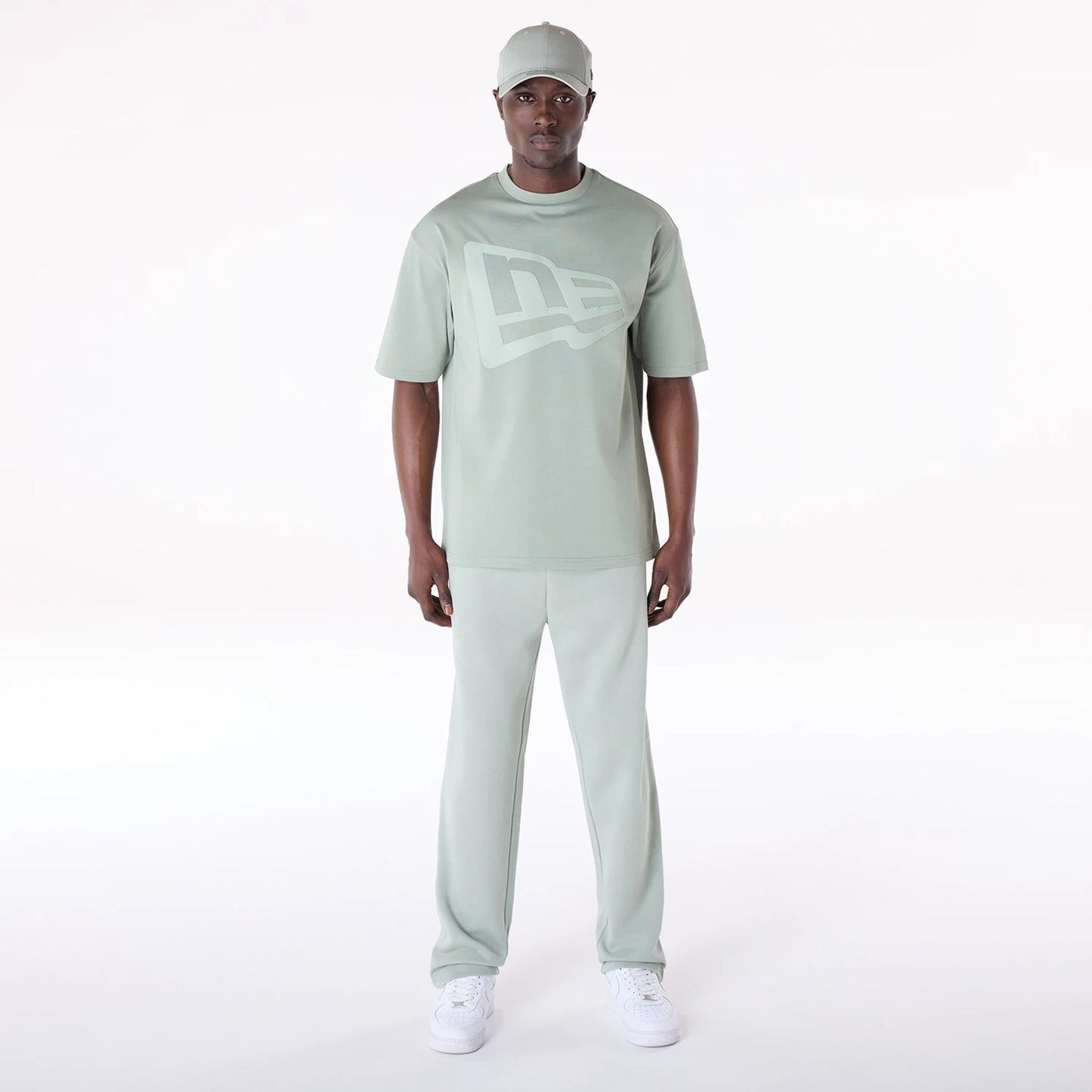 The Male model is wearing New Era Straight Leg Pastel Green Joggers 8