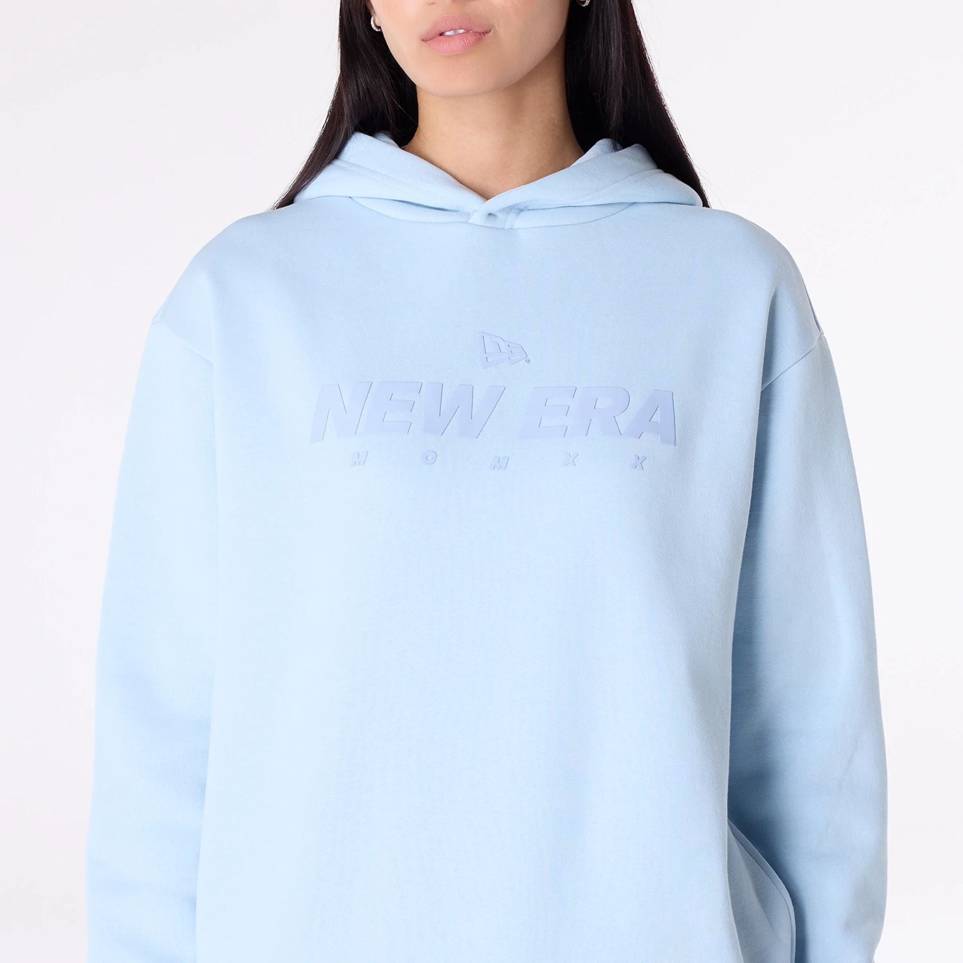 The Male model is wearing New Era Flag Pastel Blue Oversized Pullover Hoodie 3