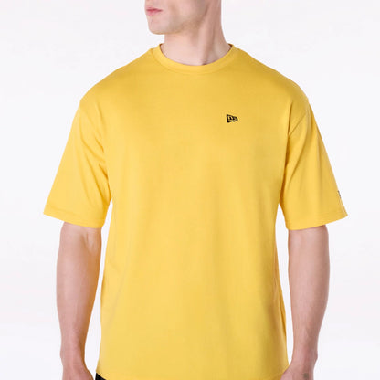 The Male model is wearing New Era Baseball Graphic Yellow Oversized T-Shirt 4